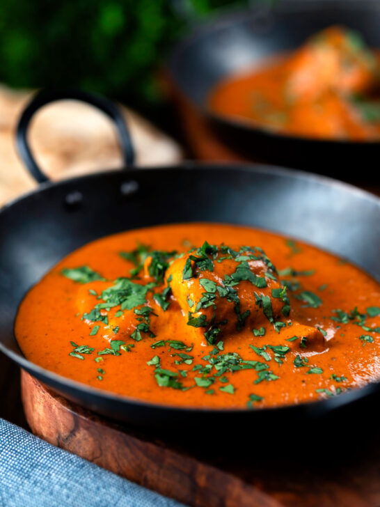 Chicken chasni curry served with naan bread.