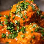 Close-up Indian inspired chicken kofta or meatball curry.