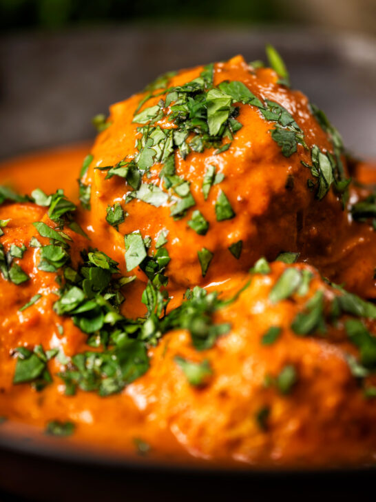 Close-up Indian inspired chicken kofta or meatball curry.