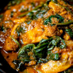 Close-up Indian inspired chicken saag or saagwala curry.