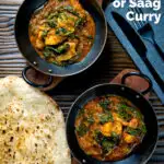 Overhead Indian inspired chicken saag or saagwala curry served with naan bread featuring a title overlay.