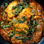 Close-up overhead Indian inspired chicken saag or saagwala curry.