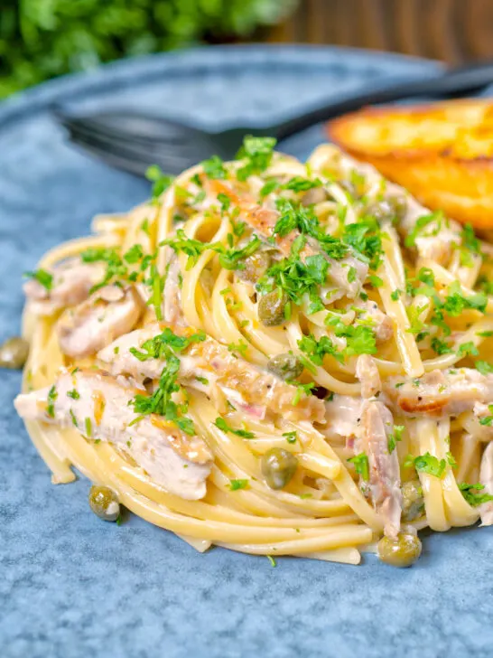 Garlicky and creamy lemon chicken pasta with capers and parsley.