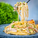Creamy garlic lemon chicken pasta with capers and parsley.