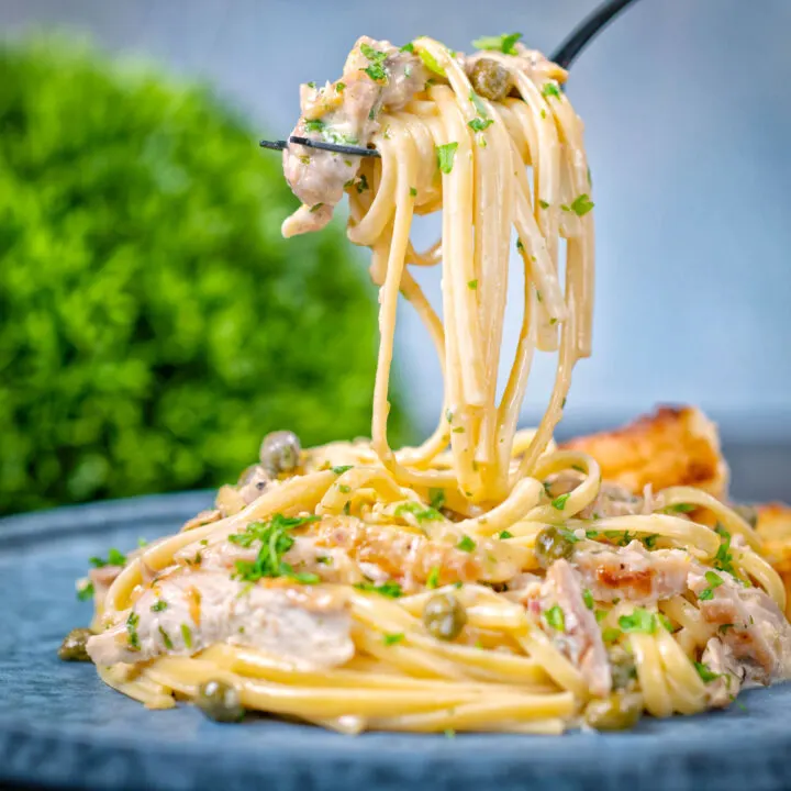 Creamy garlic lemon chicken pasta with capers and parsley.