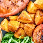 Crispy fried or sauteed potatoes served with bacon chop, grilled tomato and rocket.