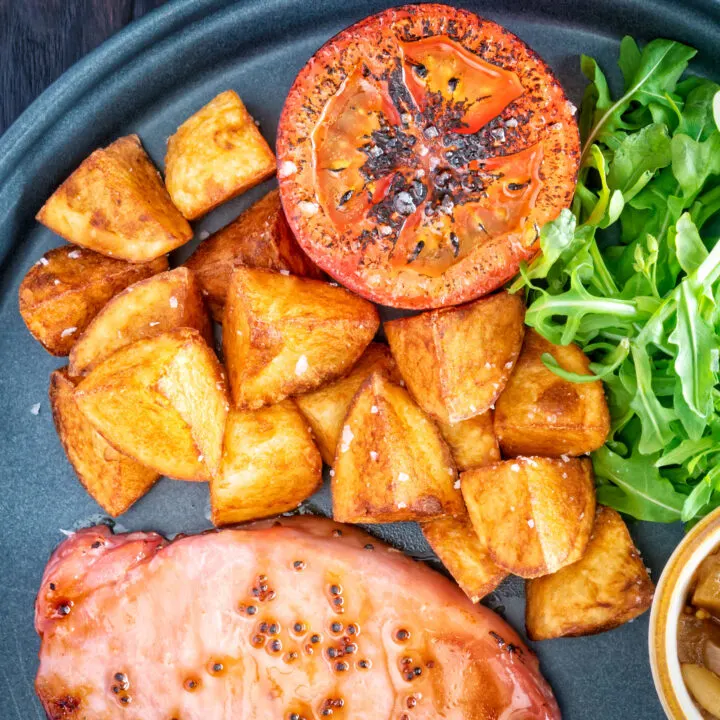 Crispy fried or sauteed potatoes served with bacon chop and grilled tomato.