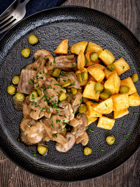 Crispy fried potatoes served as a side for beef and mushroom stroganoff.