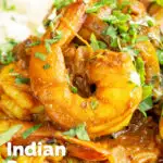 Close-up quick and easy Indian inspired prawn curry featuring a title overlay.