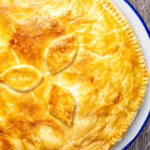 Overhead traditional British plate pie with shortcrust pastry.