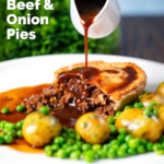 Gravy being poured over a homemade minced beef and onion pie served with peas and potatoes featuring a title overlay.