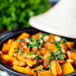 Close-up butternut squash tagine served in a tagine pot featuring a title overlay.
