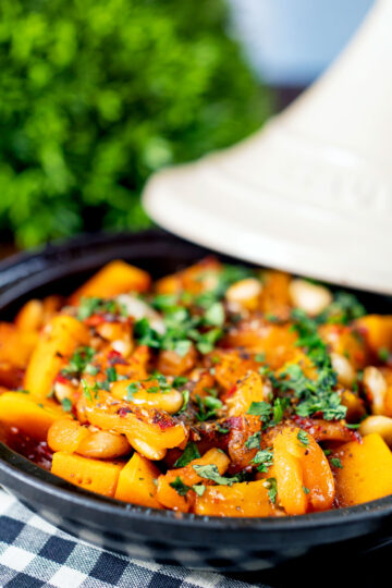 Close-up butternut squash tagine served in a tagine pot featuring a title overlay.
