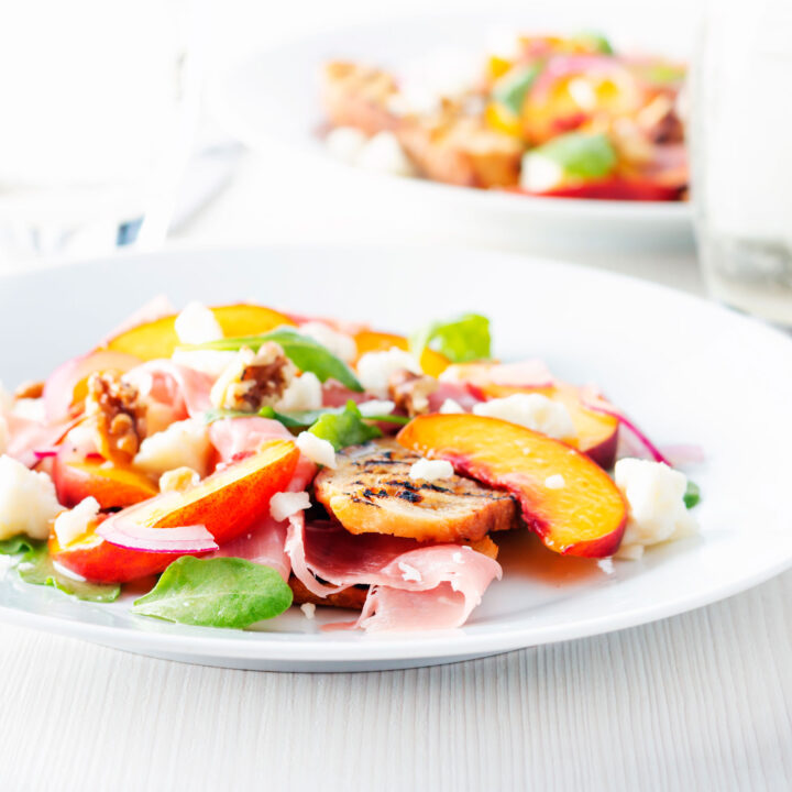 Pickled peach, goats cheese and Parma ham main course salad.