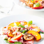 Pickled peach, rocket (arugula), goat cheese and Parma ham salad.