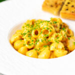 Roasted butternut squash pasta served with garlic bread.
