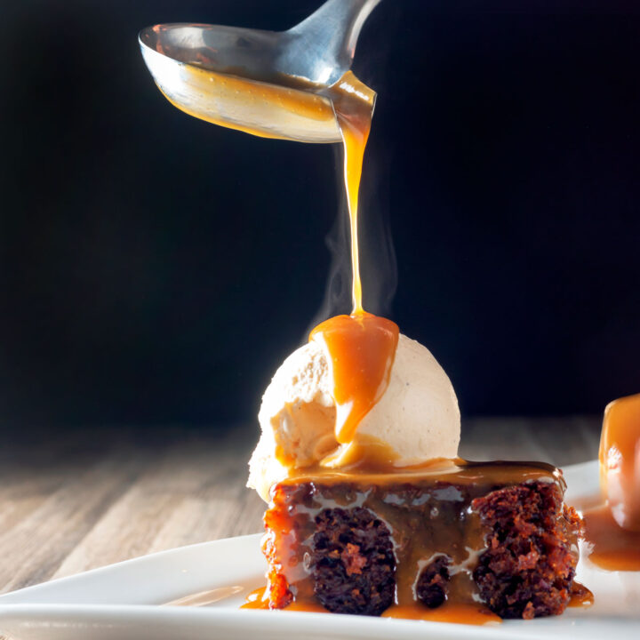 Cartmel style sticky toffee pudding served with caramel sauce and vanilla ice cream.