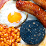 Overhead close-up of a full English breakfast or the ultimate fry up.