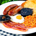 The full English breakfast, the ultimate fry up with black pudding and fried bread featuring a title overlay.