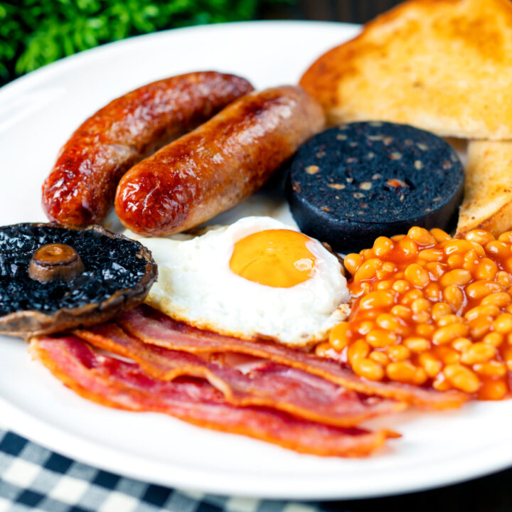 The fry up or full English breakfast with sausage, egg, bacon, beans and black pudding.