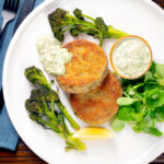 Overhead tinned mackerel fish cakes with homemade tartar sauce.
