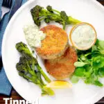 Overhead tinned mackerel fish cakes with homemade tartar sauce featuring a title overlay.