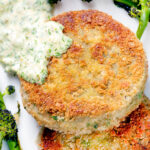 Overhead close-up tinned mackerel fish cakes with homemade tartar sauce.