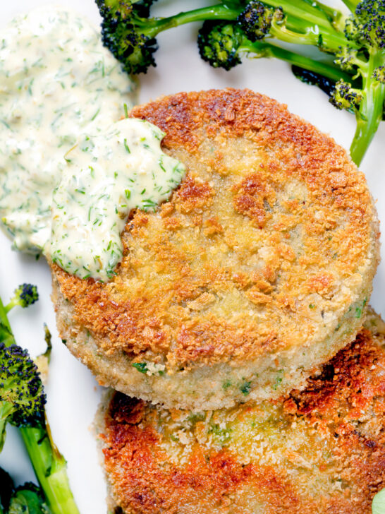 Overhead close-up tinned mackerel fish cakes with homemade tartar sauce.