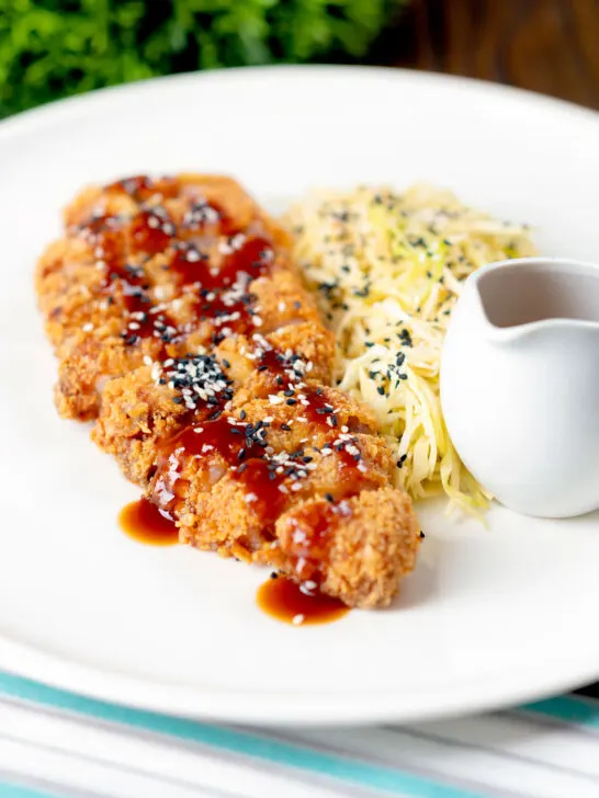 Japanese Tonkatsu pork cutlet served with katsu sauce and "soused" cabbage.