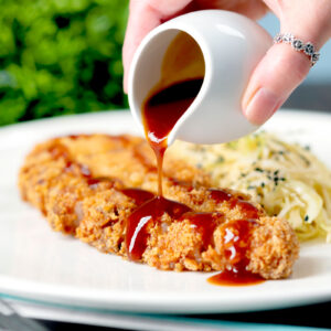 Tonkatsu a Japanese fried pork cutlet or schnitzel with "homemade" katsu sauce.