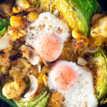 Overhead leftover cabbage and potato bake with eggs and mustard.