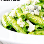 Wild garlic pesto pasta served with gorgonzola cheese featuring a title overlay.