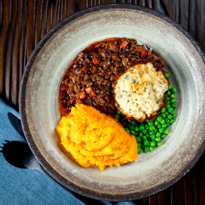British beef mince stew and dumplings served with peas and swede & carrot mash.