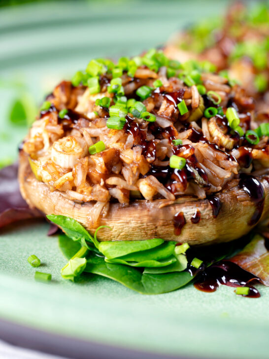 Close-up brown rice stuffed mushrooms with cheddar cheese and balsamic.
