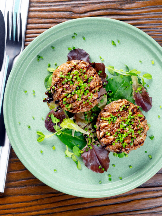 Overhead brown rice stuffed mushrooms with cheddar cheese and balsamic.