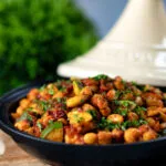 Chickpea tagine with courgettes, harissa, almonds and preserved lemons.