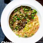 Overhead Chinese takeaway style beef curry served with egg fried rice featuring a title overlay.