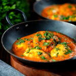 Indian inspired egg masala curry served with homemade chapatis.