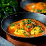 Indian inspired egg masala curry served with homemade chapatis.