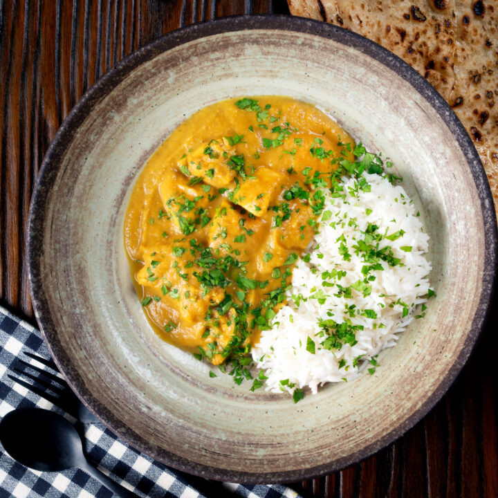 Fruity and spicy pineapple chicken curry served with rice and naan bread.