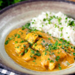 Fruity pineapple and chicken curry with rice, coriander and naan.