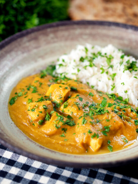 Fruity pineapple and chicken curry with rice, coriander and naan.