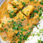 Overhead, close-up fruity pineapple and chicken curry with rice, coriander and naan featuring a title overlay.