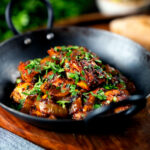 Spicy halloumi curry served with chapatis, mint raita and kachumber salad.