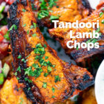 Overhead close-up grilled tandoori lamb chops with roasted Bombay potatoes featuring a title overlay.