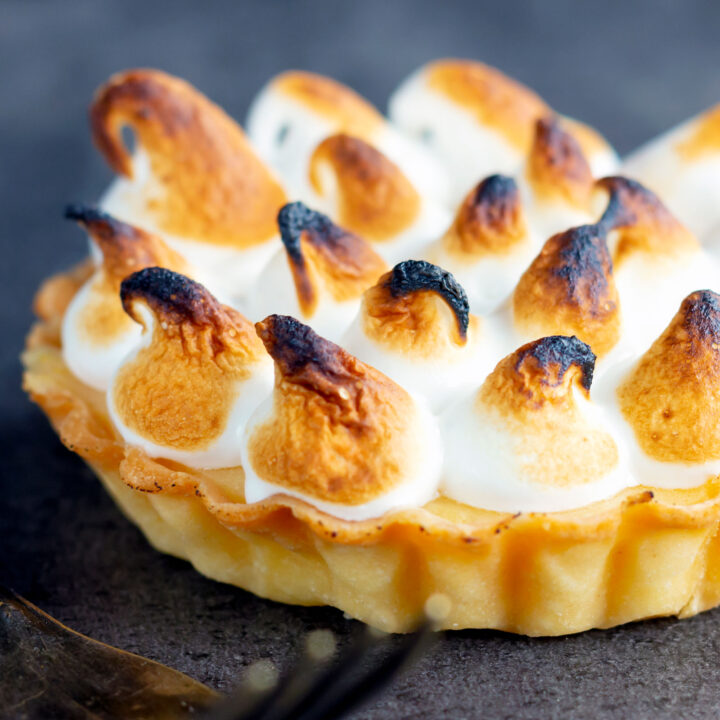 Individual or mini lemon meringue pie or tartlet with Italian meringue.