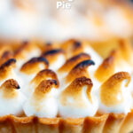 Individual lemon meringue pie with Italian meringue featuring a title overlay.