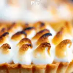 Individual lemon meringue pie with Italian meringue featuring a title overlay.