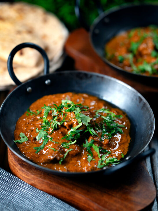 Lamb madras curry fakeaway served with homemade chapatis.