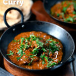 Lamb madras curry fakeaway served with homemade chapatis featuring a title overlay.